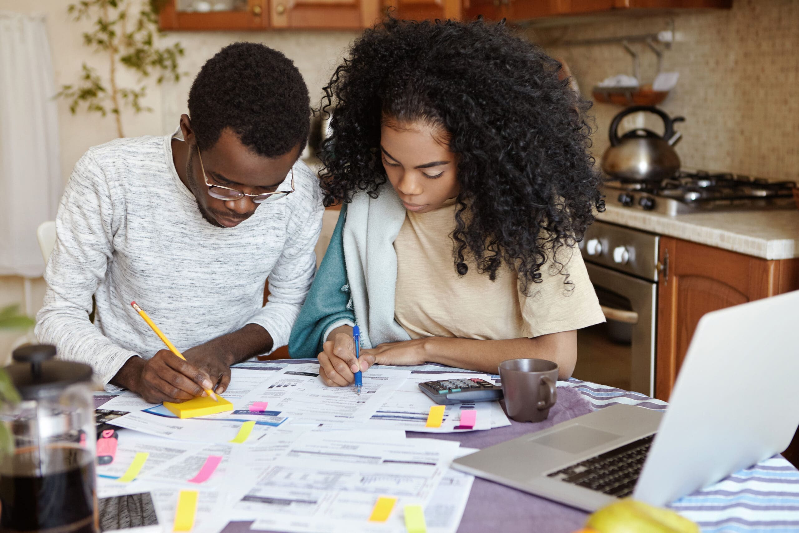 picture of father and daughter working together on budgeting