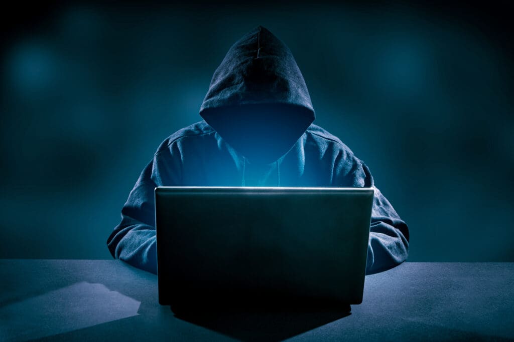 Hacker using laptop. Hacking the Internet.