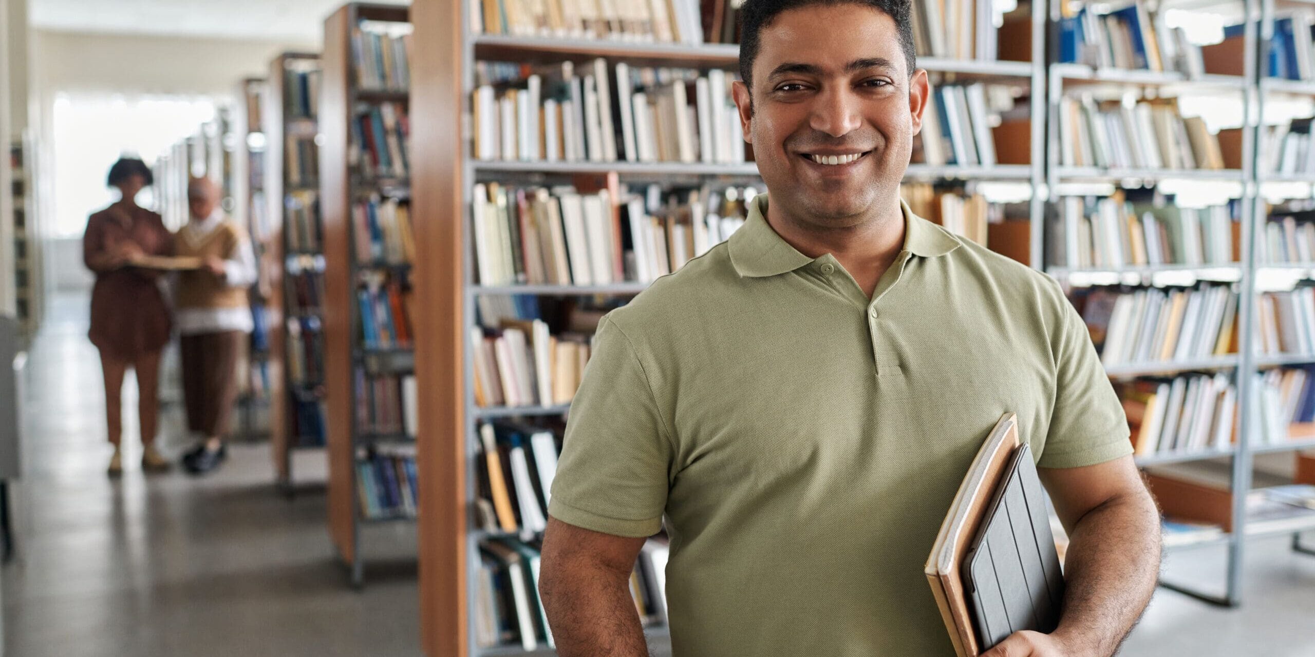 college student standing in library