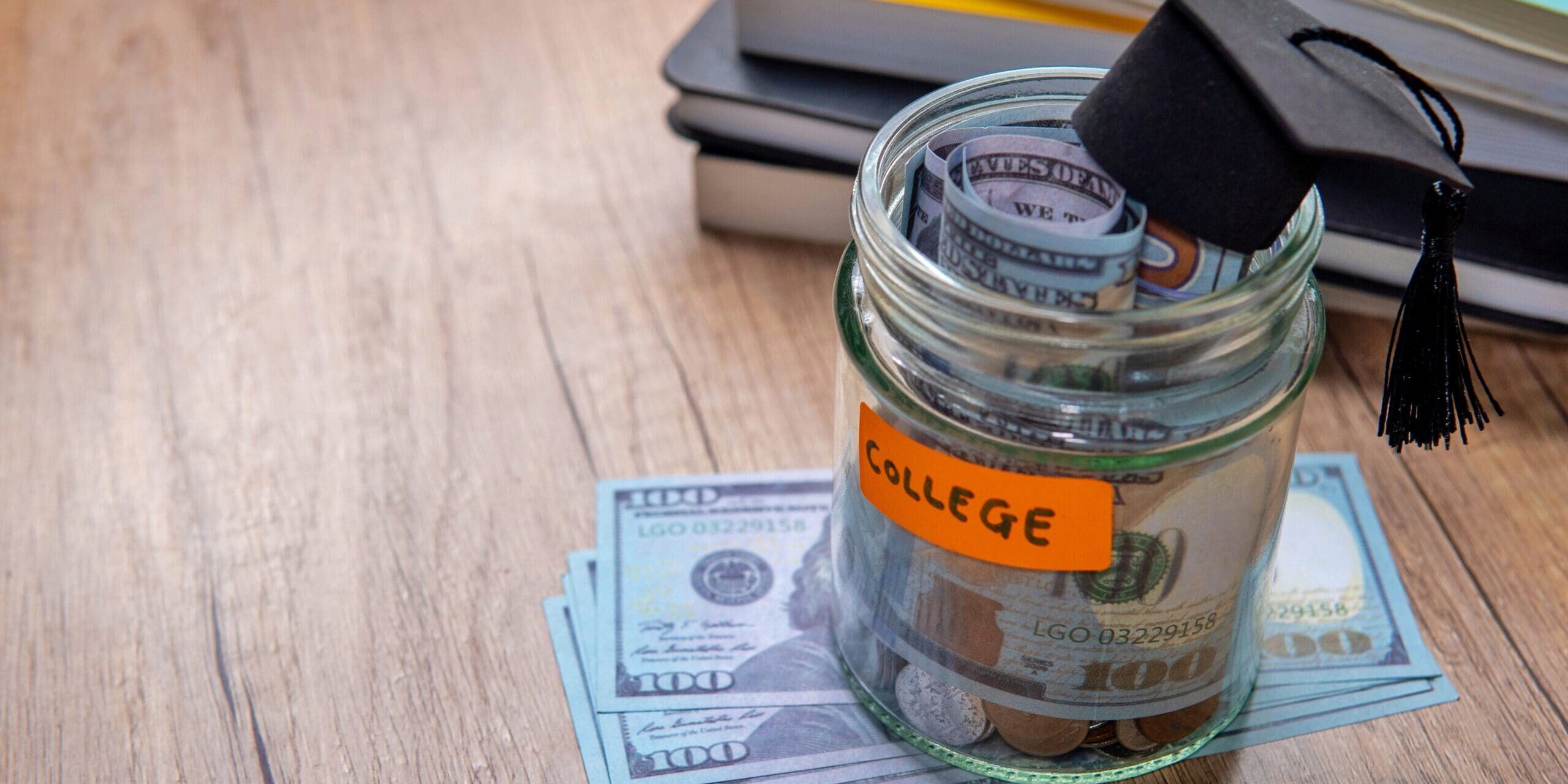 money saving jar with college sticker on it
